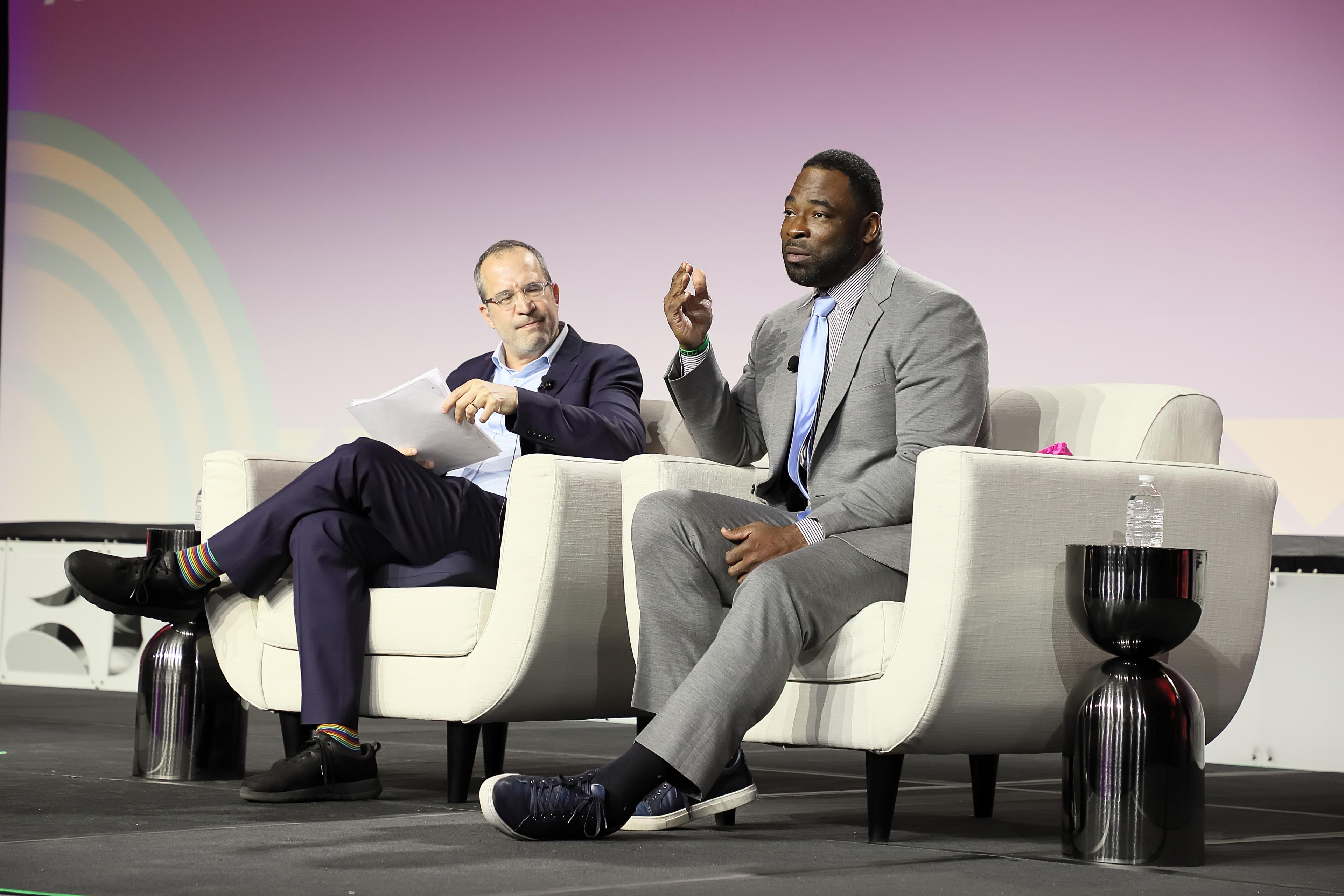 Justin Tuck and David Coleman in conversation on the main stage.