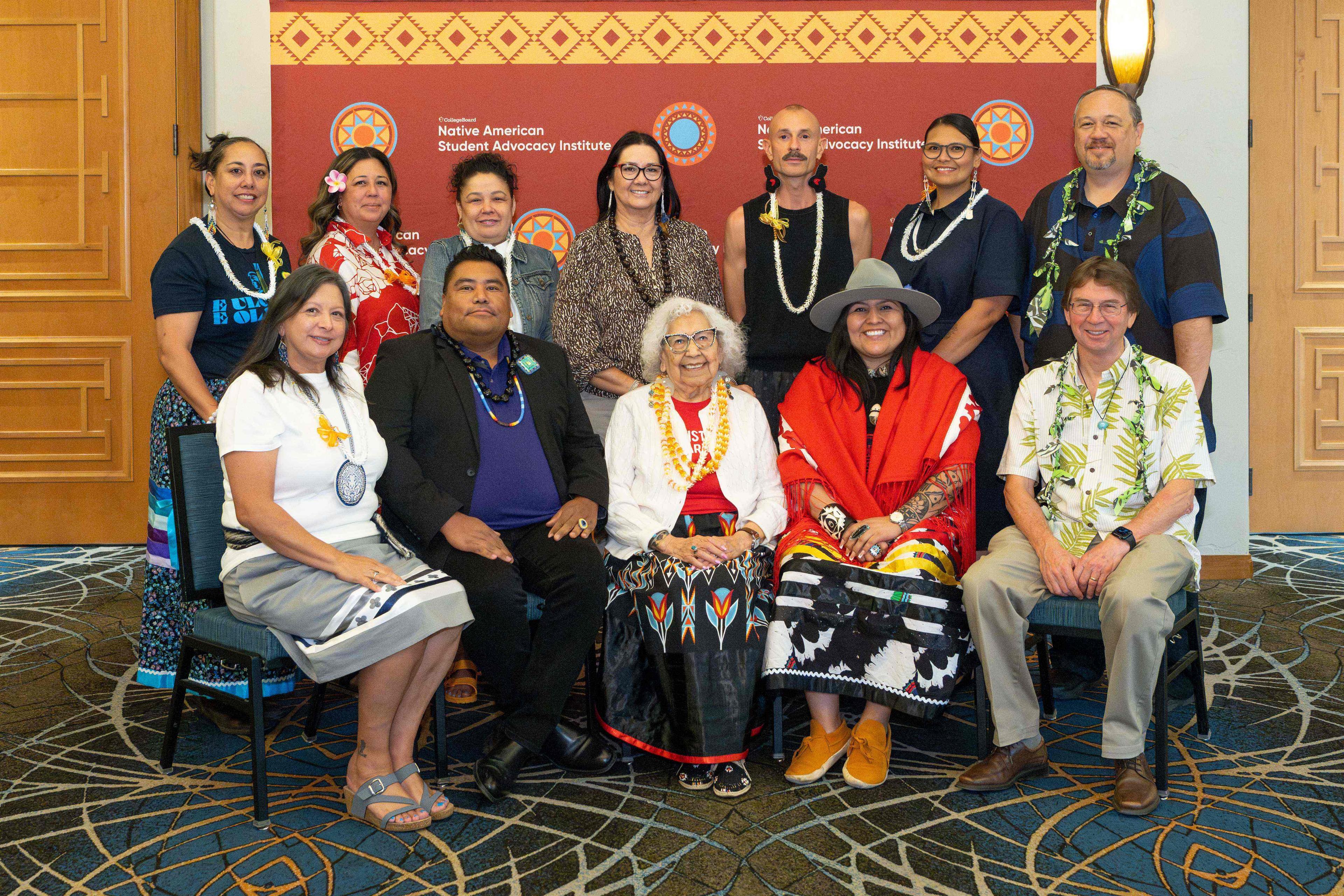 A group of women and men posing for a photo.
