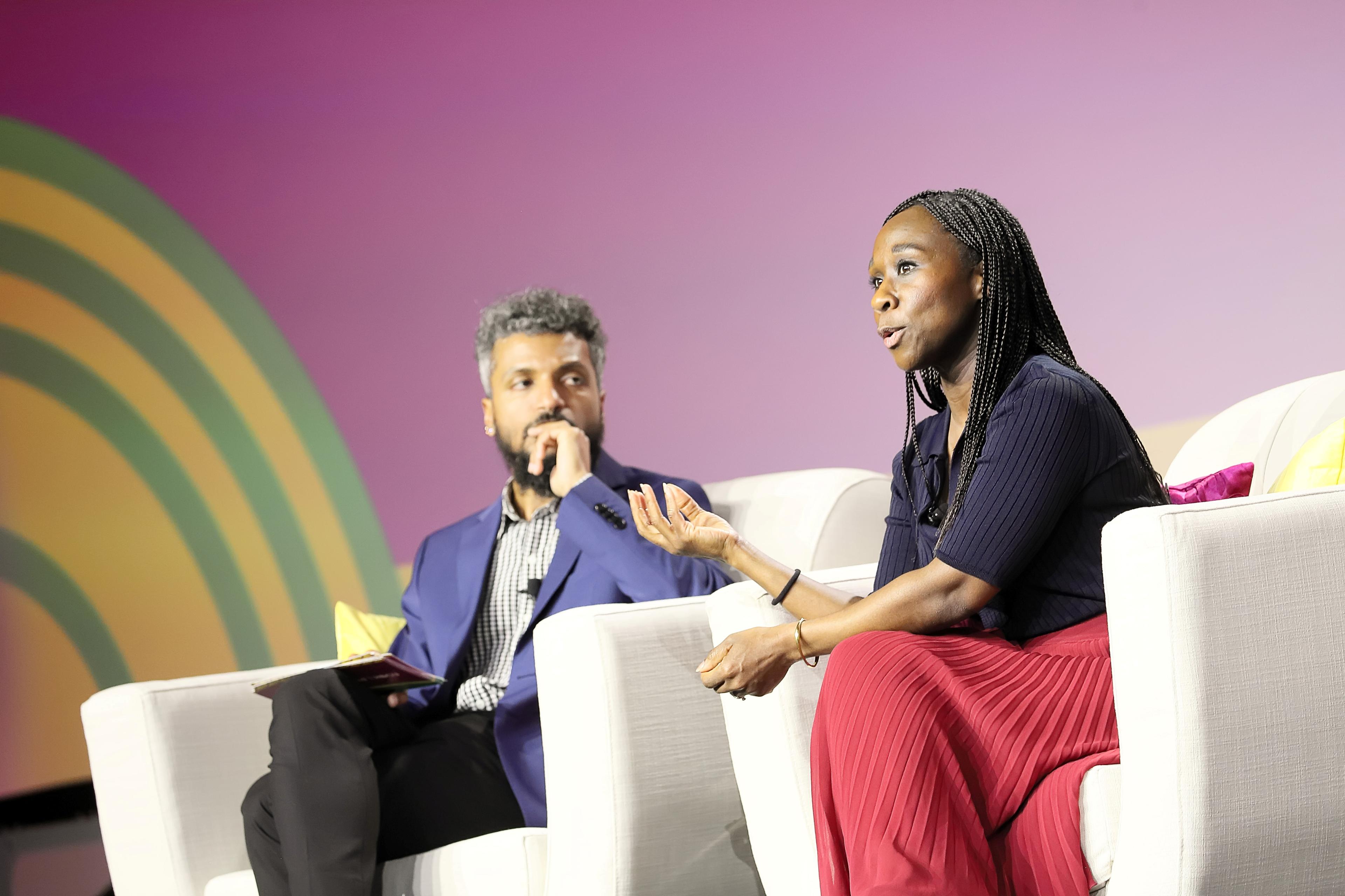Two speakers having a conversation on the main stage.